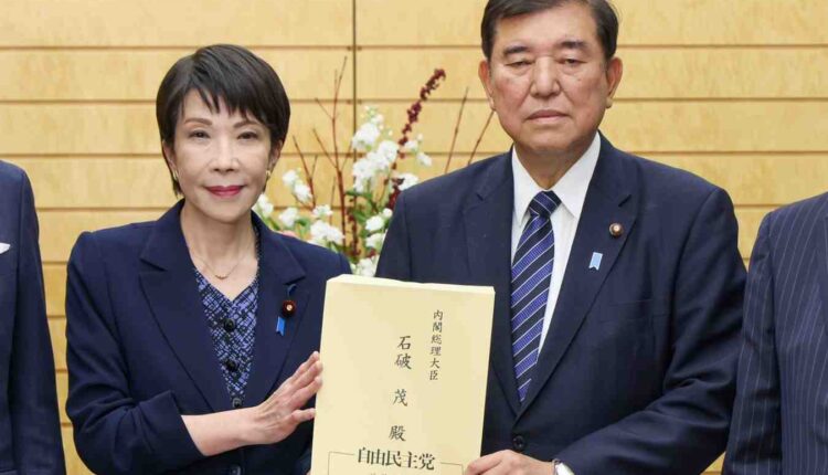Sanae Takaichi with Prime Minister Shigeru Ishiba in December last year